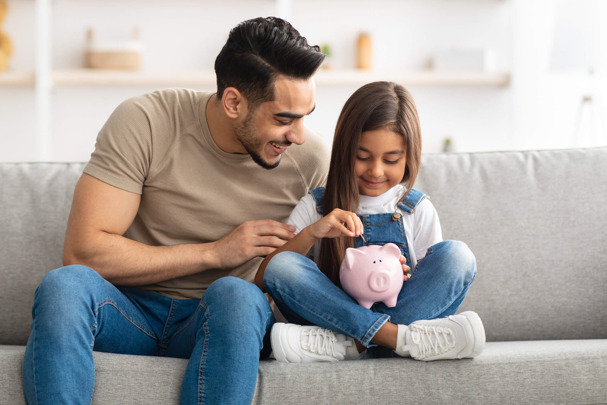 Dad and Daughter with Piggy Bank